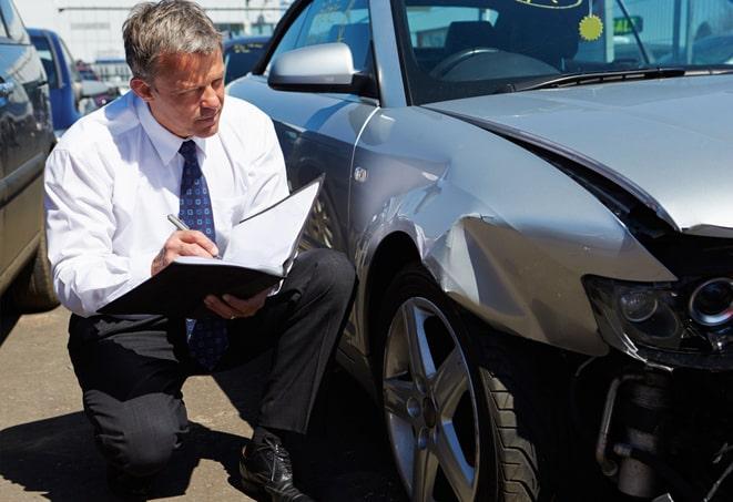 car insurance agent discussing policy options with client